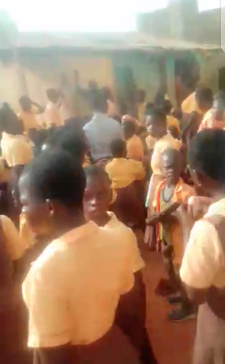 Demonstrating pupils assault linguist, convey palace stools to school