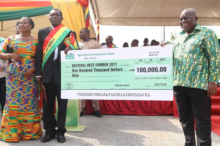 President Akufo-Addo presented a dummy cheque to Mr. Kweku Agyemang during the 2017 National Farmers Day