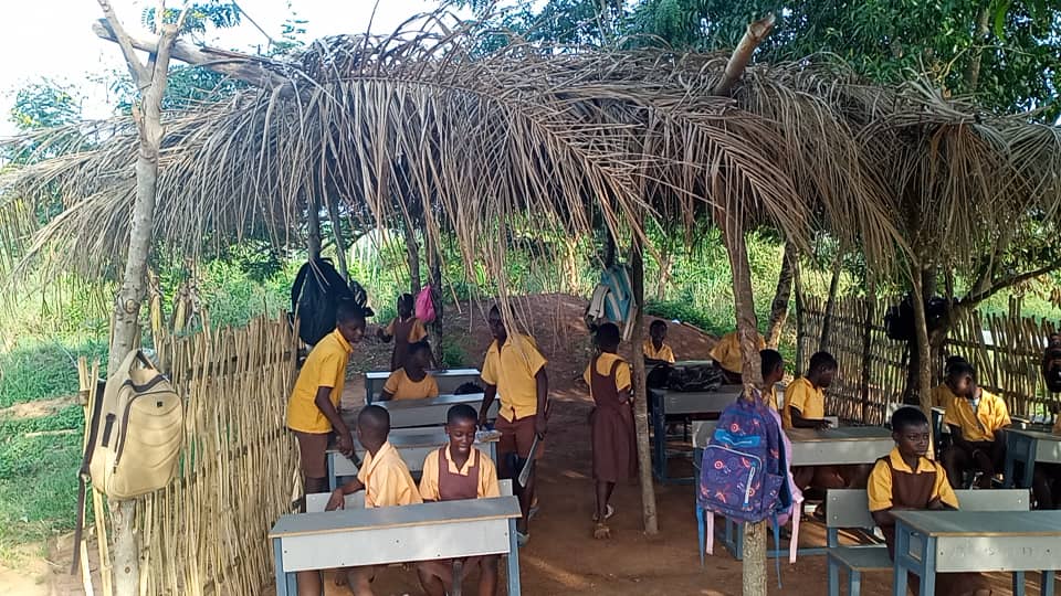 Lower Manya Krobo: Bueyonye M/A Basic School pupils study under palm tree shed
