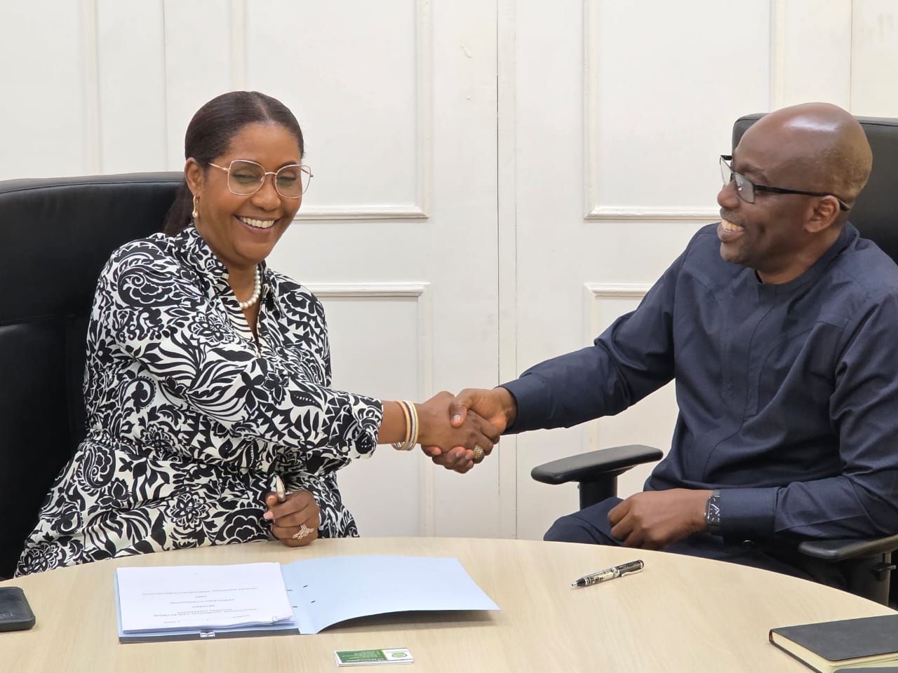 GNPC CEO, Kwame Ntow Amoah and Petroleum Commission CEO, Emeafa Hardcastle at the signing ceremony