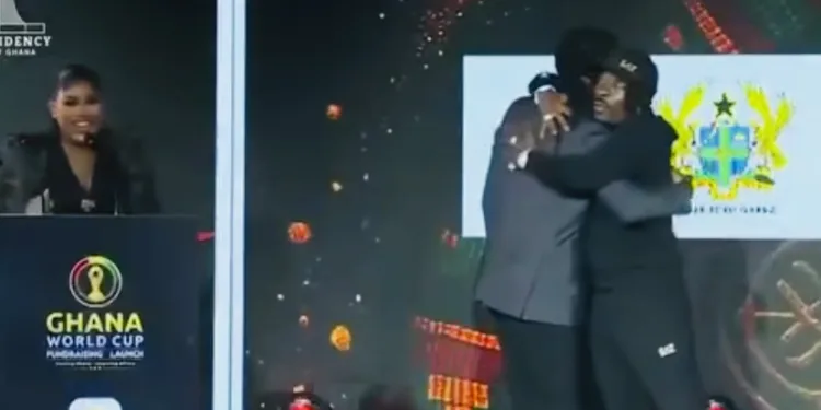Stonebwoy, Shatta Wale share rare hug at Black Stars fundraiser