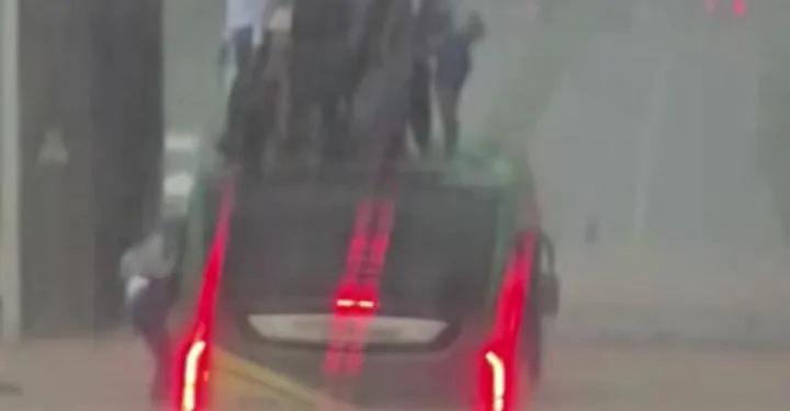 Passengers climb to safety as bus trapped in flood on Spintex–Polo Grounds road